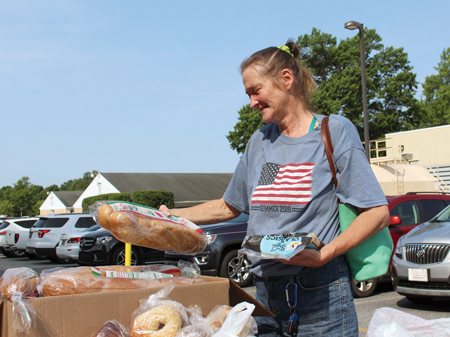Debbie selects food during the monthly Beebe Prescription Food Program.